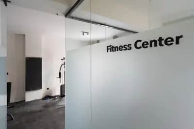 a room with a fitness center sign on the wall at Modern 2BR with Rooftop Jacuzzi & Sauna Access in Athens