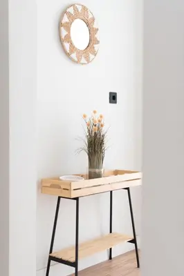 a console table with a mirror on the wall at Stylish 2BR Apt, Rooftop with Sauna & Hot Tub in Athens