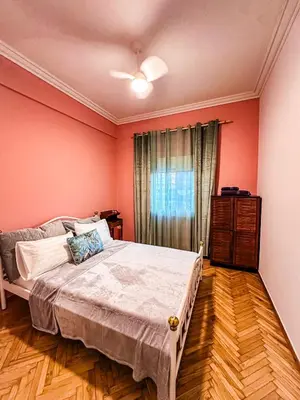 a bedroom with red walls and a large bed at The North Nest in Athens