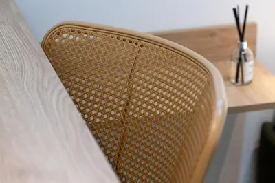 a close up of a chair next to a table at Pasalimani Seabreeze Apartment in Piraeus