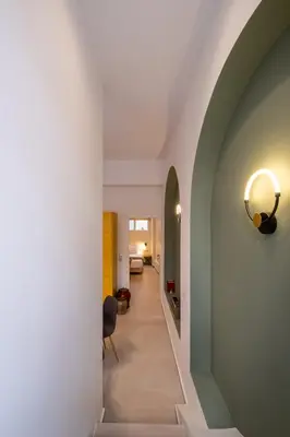 a hallway of a house with an archway at Pasalimani Seabreeze Apartment in Piraeus