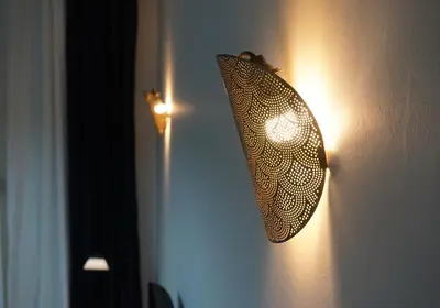 a light on a wall with a butterfly on it at Athens City apartment in Athens