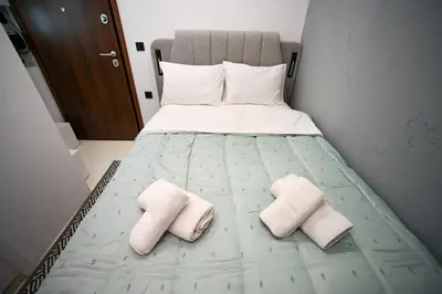a bed with two pillows on it in a room at Evagelistrias Monastiraki Suite by Zeussuites in Athens