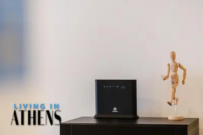 a mannequin standing on a dresser next to a television at Comfortable & Modern Apt 4floor 3ppl in Piraeus