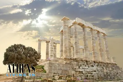 an ancient building with columns in front of the sun at Comfortable & Modern Apt 4floor 3ppl in Piraeus