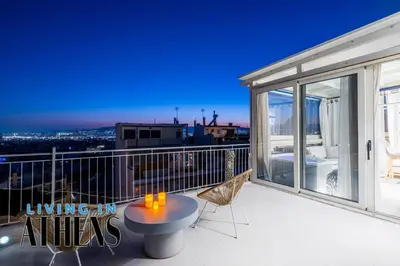 a balcony with a table and chairs on it at Breathtaking View Studio With Jacuzzi 2ppl 6th flr in Athens