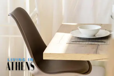 a table with a chair and a bowl on it at Breathtaking View Studio With Jacuzzi 2ppl 6th flr in Athens