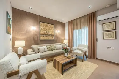a living room with a couch and two chairs at Crown Design Apt - Acropolis in Athens