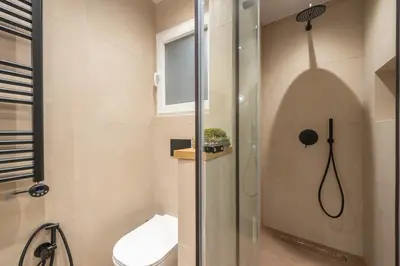 a bathroom with a shower and a toilet at Crown Design Apt - Acropolis in Athens