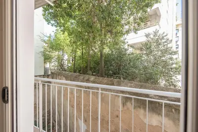a view from the door of a balcony with a fence at Crown Design Apt - Acropolis in Athens