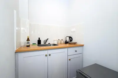 a kitchen with a sink and a counter top at Muse Studios & Apartments Escape in Agia Marina Aegina