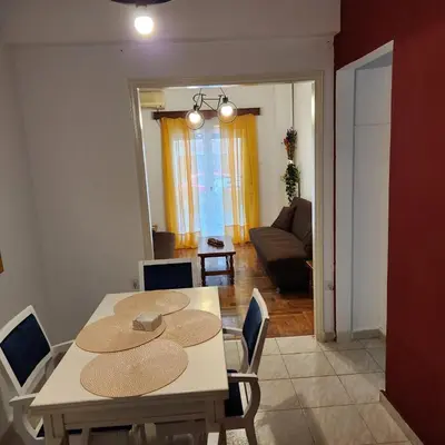a dining room with a table with hats on it at Athens Nest two in Athens