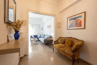 a living room with a couch and a table at Comfort Apartment with 2 Bedrooms in Athens