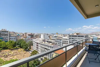 a balcony with a view of a city at Piraeus Riviera Residence in Piraeus