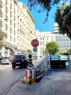 a stop sign on the side of a city street at Family Luxury Suite by Zeus Suites in Athens