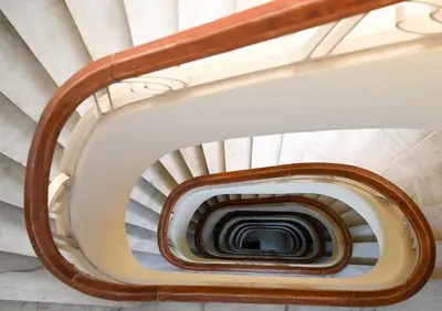 a spiral staircase in a building at Family Luxury Suite by Zeus Suites in Athens