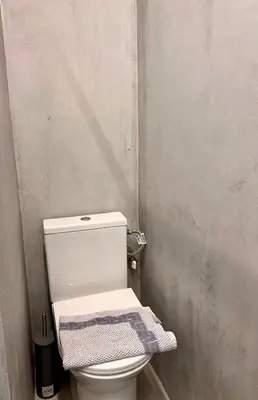 a bathroom with a toilet with a towel on it at Hera Luxury Suite by Zeus Suites in Athens