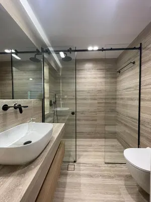a bathroom with a tub and a sink and a shower at Voula Lemon Garden by Taurus in Athens
