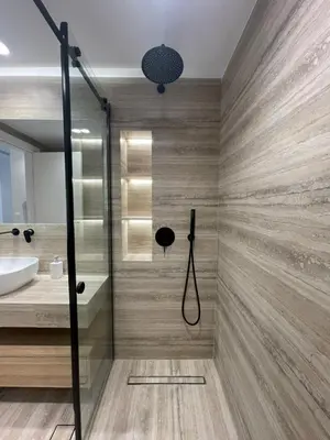 a bathroom with a shower and a sink at Voula Lemon Garden by Taurus in Athens