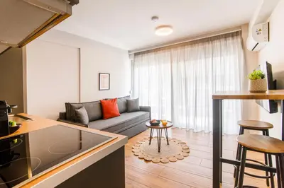 a living room with a couch and a table at Kali 56 in Athens