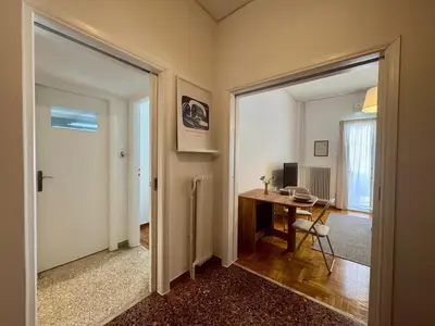 a room with a table and a desk with a computer at Arisa Apartment in Athens next to Metro Station in Athens