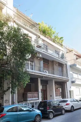 a building with cars parked in front of it at Cozy Minimal Studio by Ampelokipoi Metro in Athens
