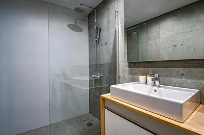 a bathroom with a sink and a shower at Classic & Charming 2BR, Petralona Metro in Athens