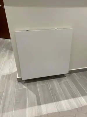 a white object is sitting on the floor at Stylish Apartment-Κέντρο Αθήνα-15' περπάτημα από την Ακρόπολη in Athens