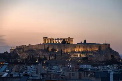 ahenshenshenshenshenshens city skyline at sunset with the acropolis at Acropolis view luxury apartment in Athens