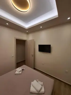 a room with a bed with two towels on it at Acropolis view luxury apartment in Athens