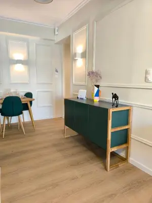 a room with a desk with a black cat on it at Chic Athenian Apartment by the Riviera in Athens
