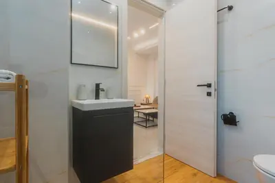 a bathroom with a sink and a toilet at Calmio Athens 4 in Athens