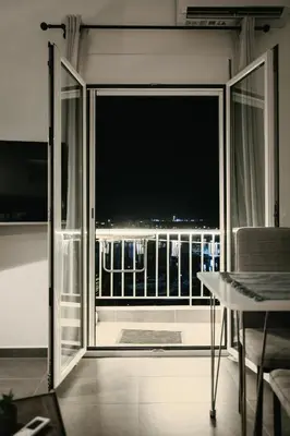 an open door to a balcony with a view at Luxury 2BR Penthouse Marina & Sea Views in Piraeus
