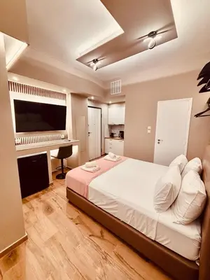 a bedroom with a large bed and a piano at Monastiraki 110 SuperHost Hub in Athens