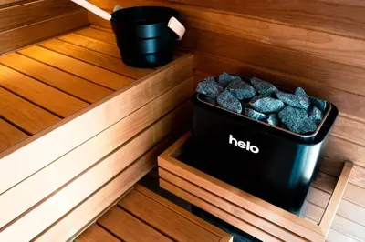 a trash can in a sauna with rocks in it at Skyline Spa Athens 001 in Athens