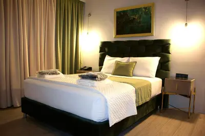 a bedroom with a large bed in a room at VIP Suite 107 - Castle De Paris in Athens