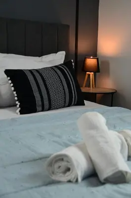 a bedroom with a bed with towels on it at Spacious house by the sea in Athens
