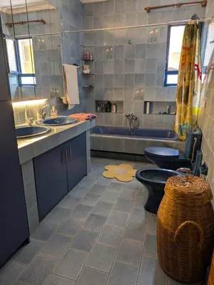 a bathroom with two sinks and a toilet and a tub at Family apartment mountain and sea in Athens