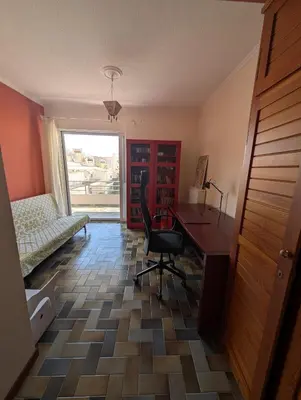 a room with a desk and a chair and a window at Family apartment mountain and sea in Athens