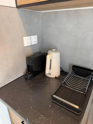 a kitchen counter with a toaster and a blender at FiftyFiveLoft in Ano Glyfada in Athens