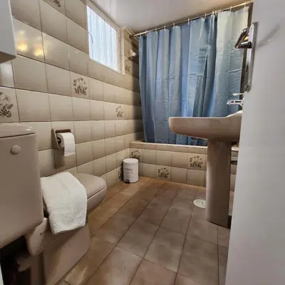 a bathroom with a sink and a toilet at Athens Acropolis in Athens