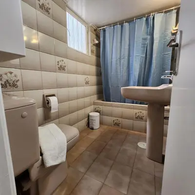 a small bathroom with a sink and a toilet at Athens Acropolis in Athens