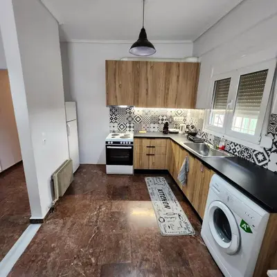 a kitchen with a sink and a stove and a dishwasher at Athens Acropolis in Athens