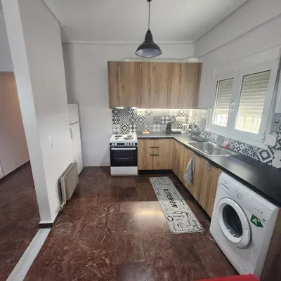 a kitchen with a washer and a sink and a dishwasher at Athens Acropolis in Athens