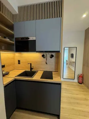 a kitchen with a sink and a counter top at JKB Panoramic Suites in Athens