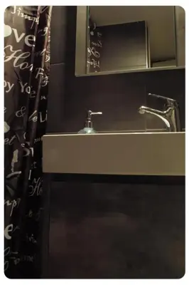 a bathroom sink with a mirror and a shower curtain at Cute apartment Center of Athens Petralona station in Athens