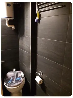 a bathroom with a toilet with a sink in it at Cute apartment Center of Athens Petralona station in Athens