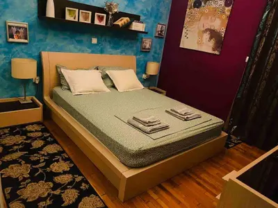 a bedroom with a bed in a room at In the heart of Athens! Panoramic view of the Acropolis! in Athens