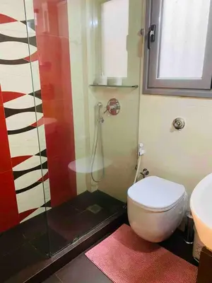 a bathroom with a shower with a toilet and a sink at In the heart of Athens! Panoramic view of the Acropolis! in Athens