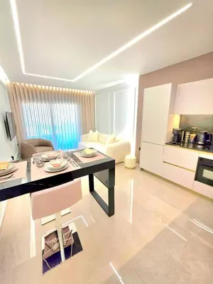 a kitchen and a living room with a dining table and a living room at N K Suite - Design Boutique Stay with City view in Athens